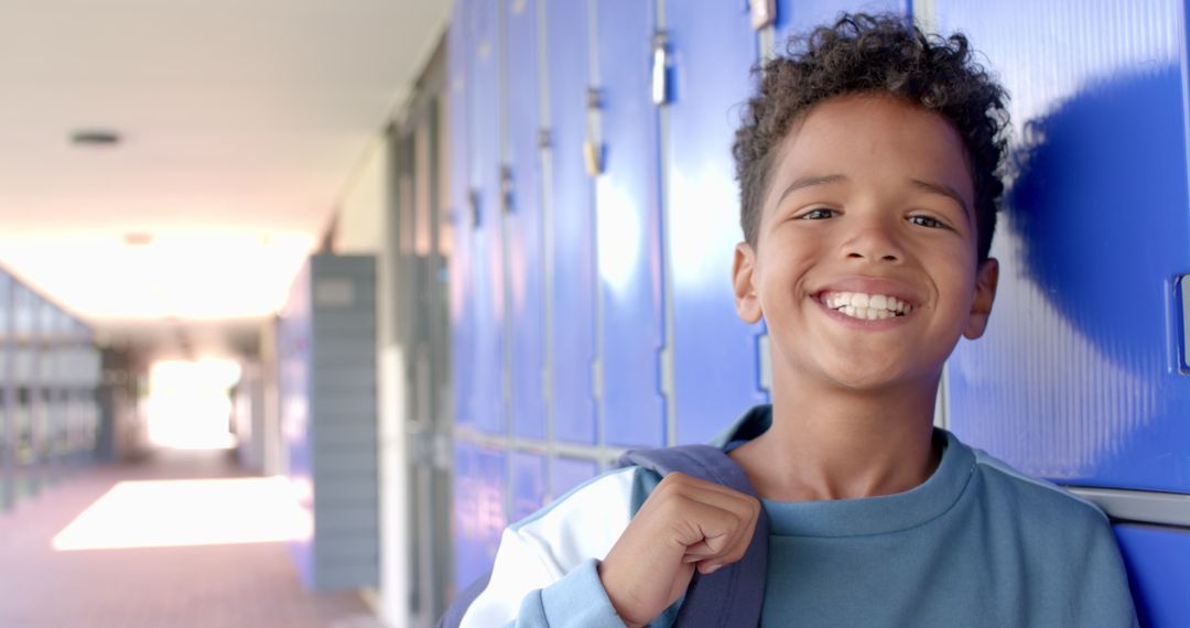 Happy Biracial Boy Smiling in School Corridor