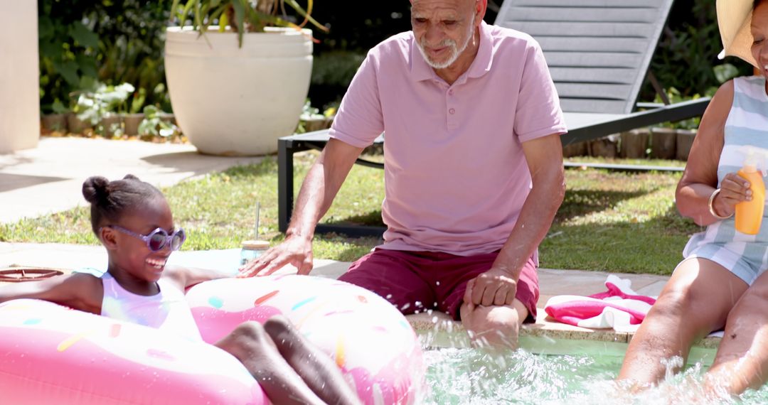 Outdoor Family Fun with Girl in Pool on Donut Float