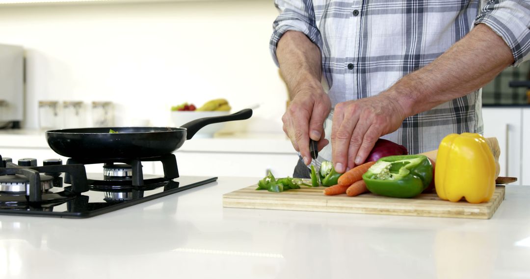 Senior Man Chopping Fresh Vegetables in Modern Kitchen - Free Images, Stock Photos and Pictures on Pikwizard.com