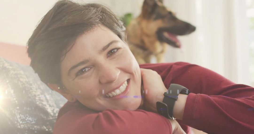 Smiling Woman Relaxing at Home with German Shepherd