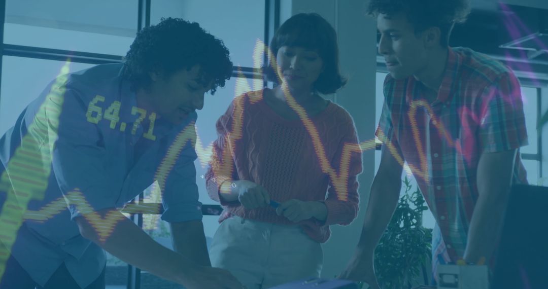 Team Analyzing Financial Data Visualization in Office Environment