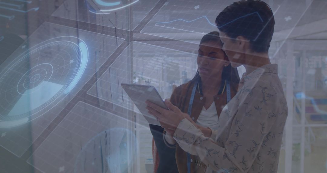 Designers Analyzing Holographic Interface on Tablet