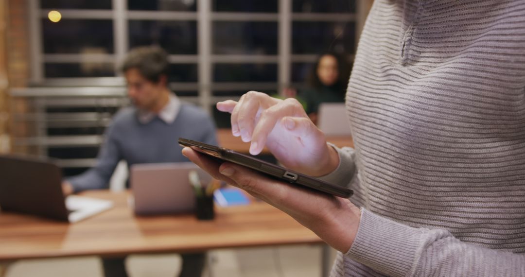 Professional Businesswoman Using Tablet in Modern Office Environment