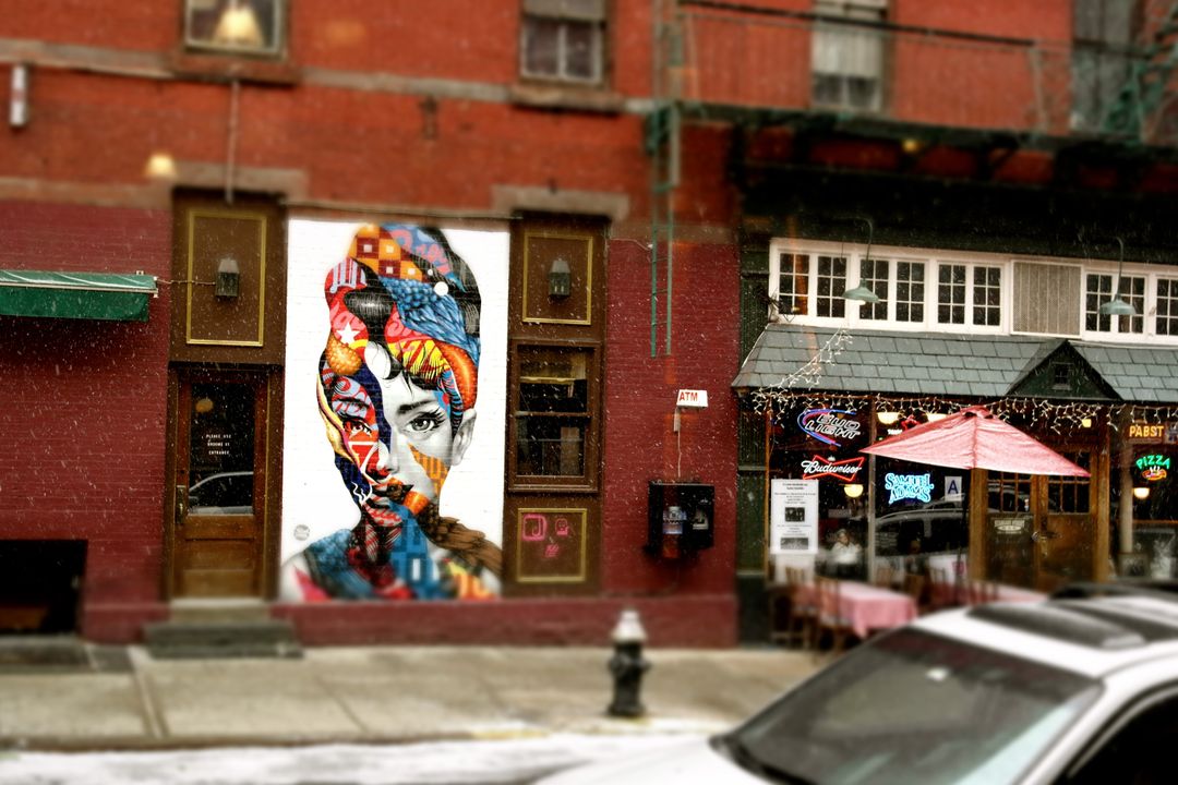 Vibrant Street Art Mural Depicting Woman's Face on Urban Building - Free Images, Stock Photos and Pictures on Pikwizard.com