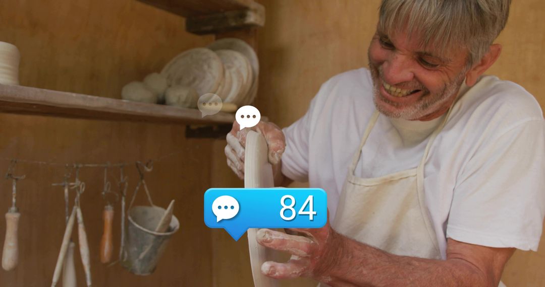 Senior Male Potter Trimming Ceramic Bowl in Warm Workshop with Social Media Comment Bubble