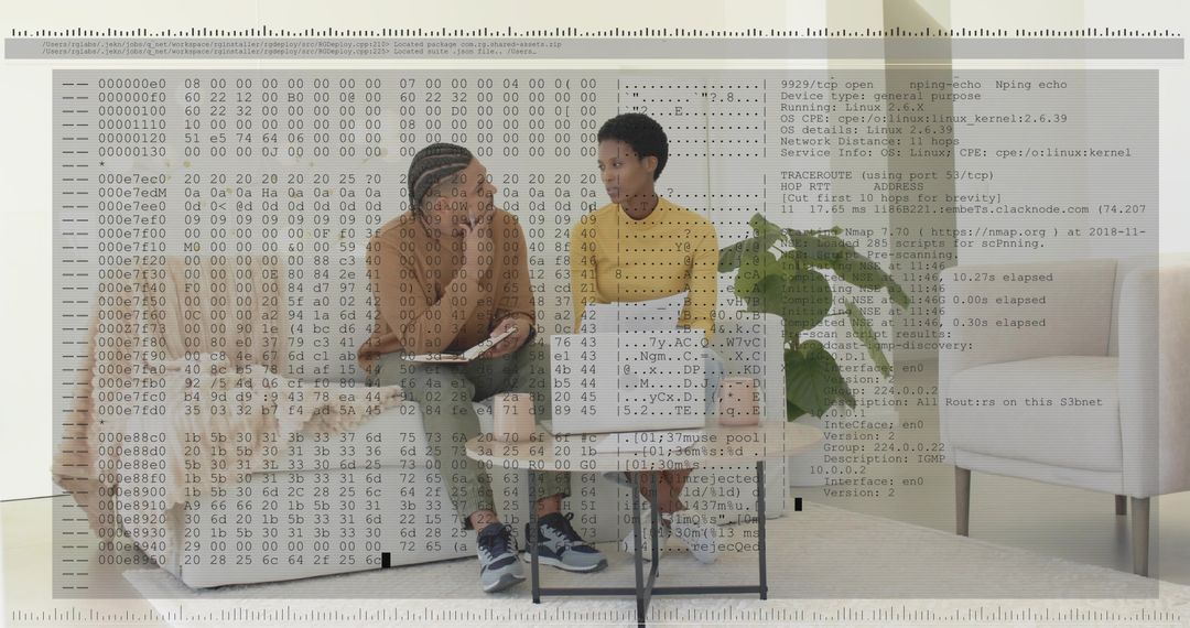 Discussing code while collaborating on laptop in modern living room