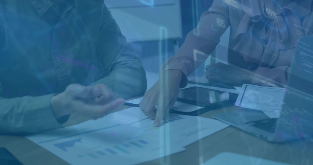 Business Professionals Analyzing Financial Data on Digital Charts