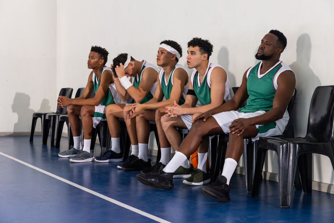 Diverse Basketball Team Mentally Preparing Sideline