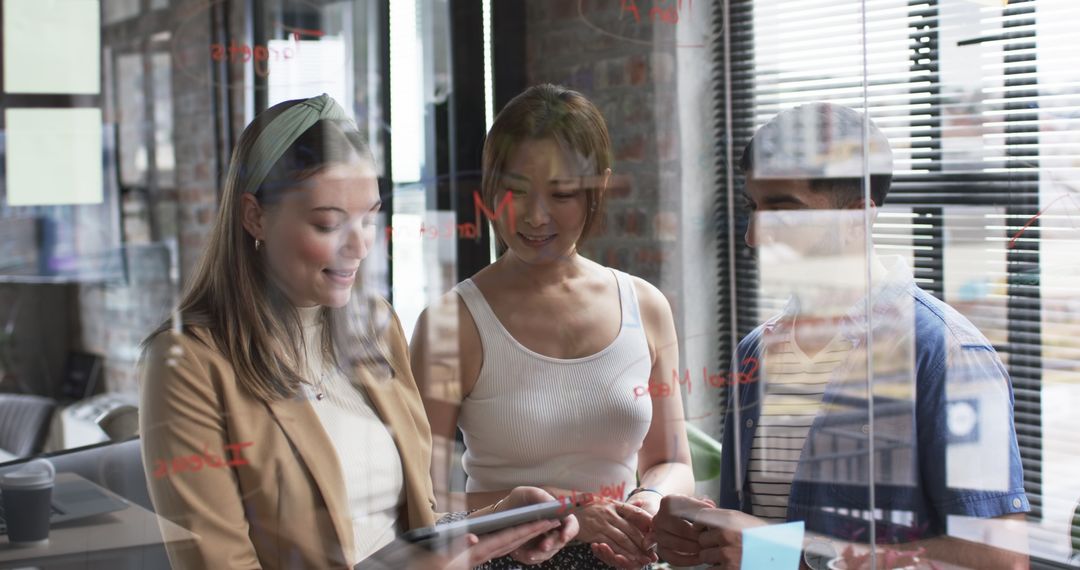 Diverse Team Analyzing Presentation Through Digital Tablet in Meeting