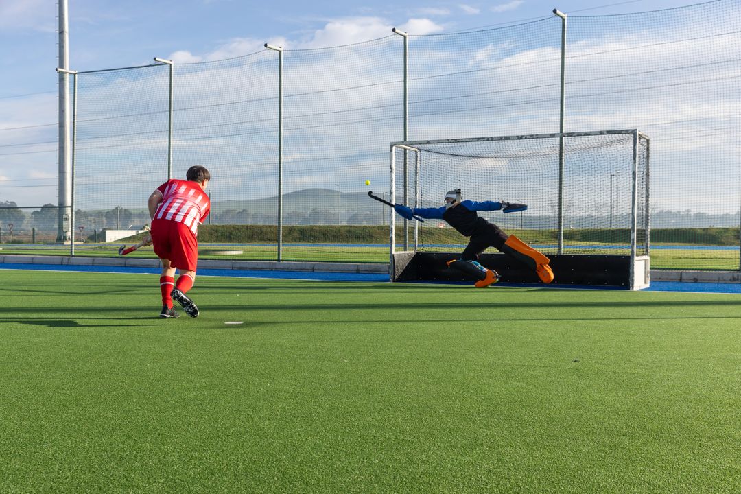 Intense Field Hockey Game with Goal Scoring Action