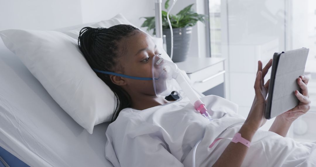 African American Woman in Hospital Bed Using Tablet Device - Free Images, Stock Photos and Pictures on Pikwizard.com