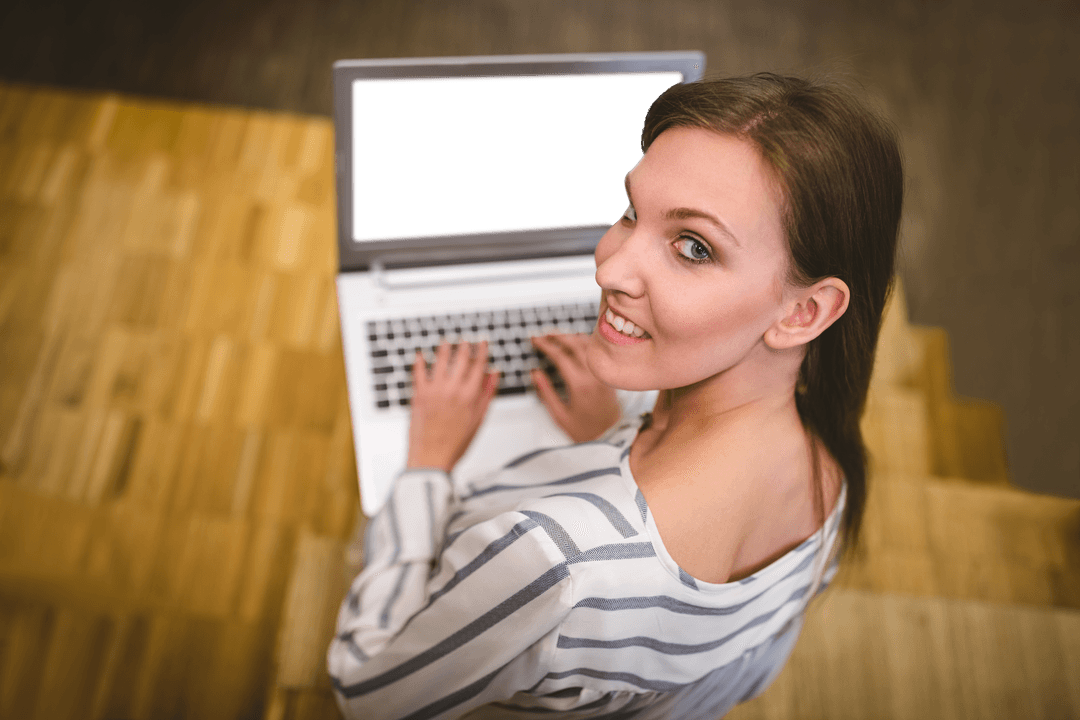 Portrait of Smiling Woman Using Laptop on Transparent Hardwood Floor