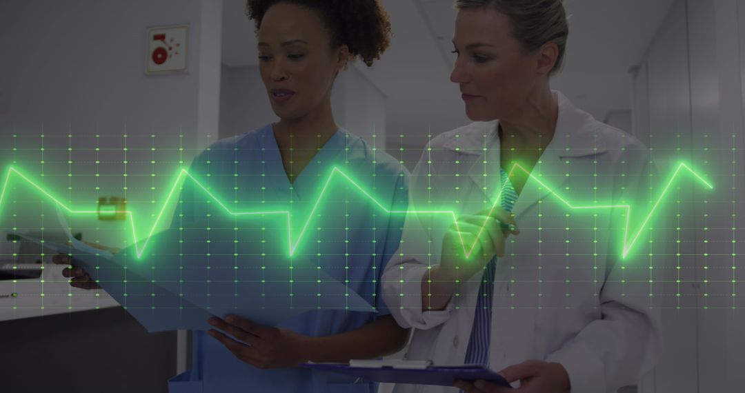 Healthcare Professionals Analyzing Heart Rate Monitor Data in Hospital