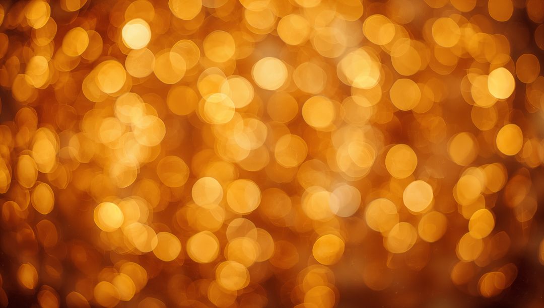Golden bokeh lights background glowing warm amber circles festive abstract blur texture
