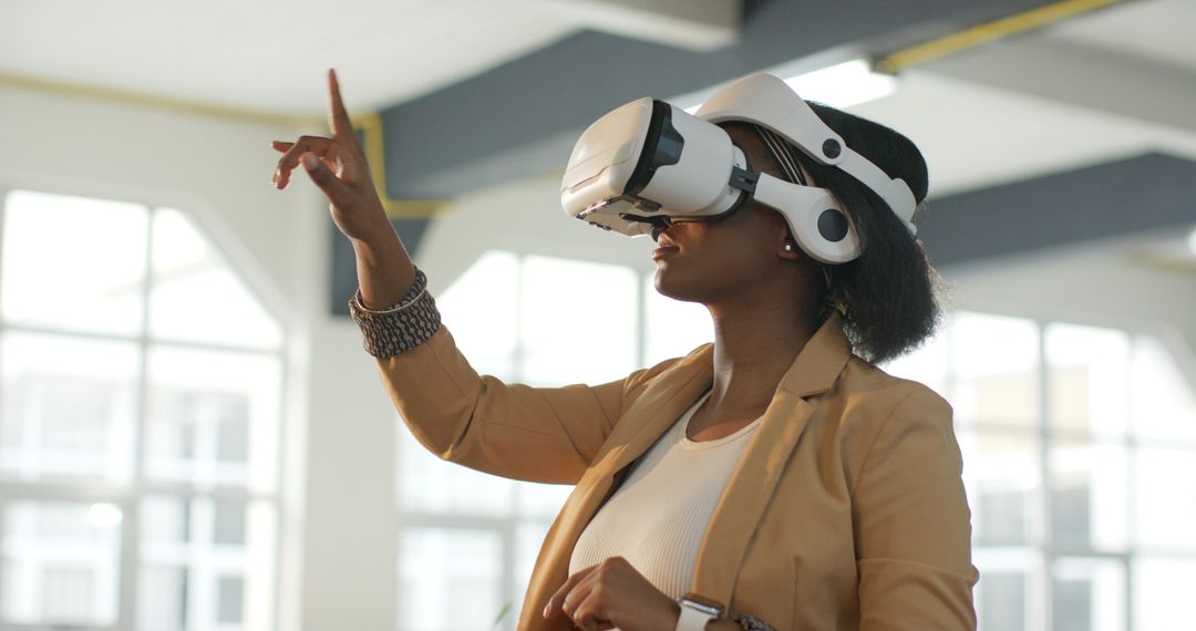 African American Professional Using VR Headset Pointing to Virtual Interface in Office