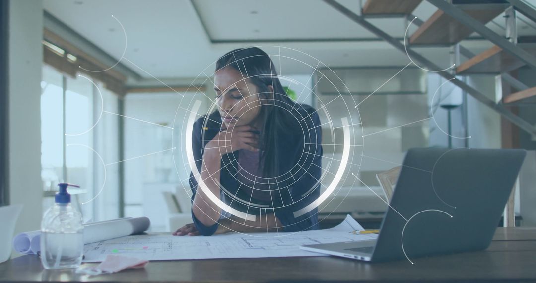 Female Architect Analyzing Blueprints in Modern Home Office