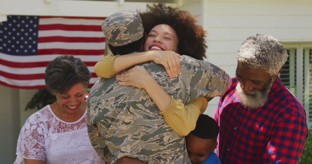 Reuniting Family Embracing Returning Military Hero