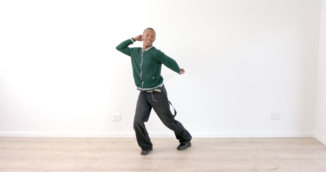 Energetic Man Dancing Joyfully in Spacious Room