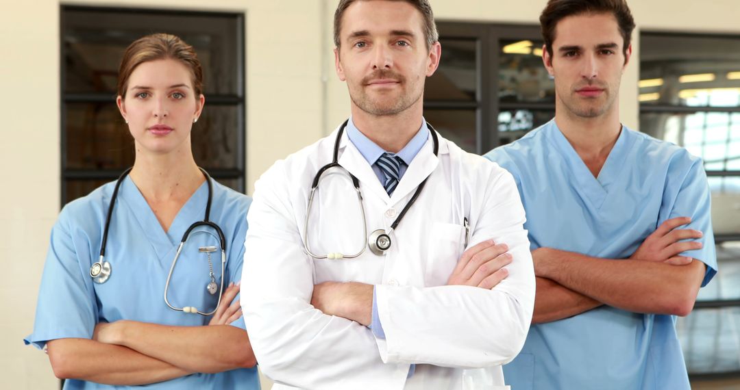 A mixed team of medical staff, led by a doctor, poses ready for action. - Free Images, Stock Photos and Pictures on Pikwizard.com