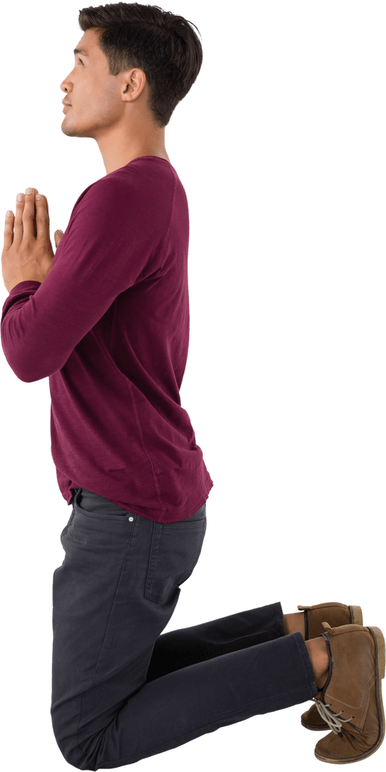 Kneeling Young Man Praying in Maroon Sweater on Transparent Background