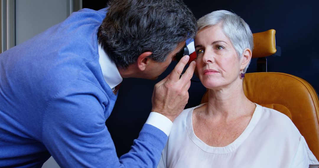 Eye Doctor Conducting Eye Examination on Senior Woman - Free Images, Stock Photos and Pictures on Pikwizard.com