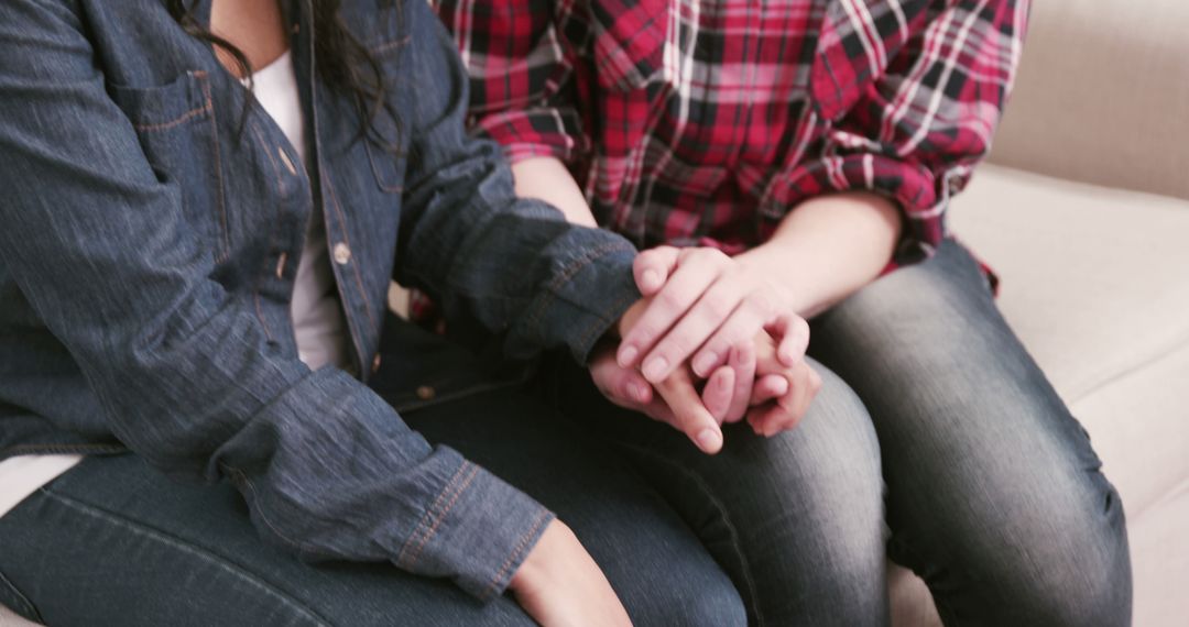 Close-Up of Two Friends Holding Hands for Comfort - Free Images, Stock Photos and Pictures on Pikwizard.com