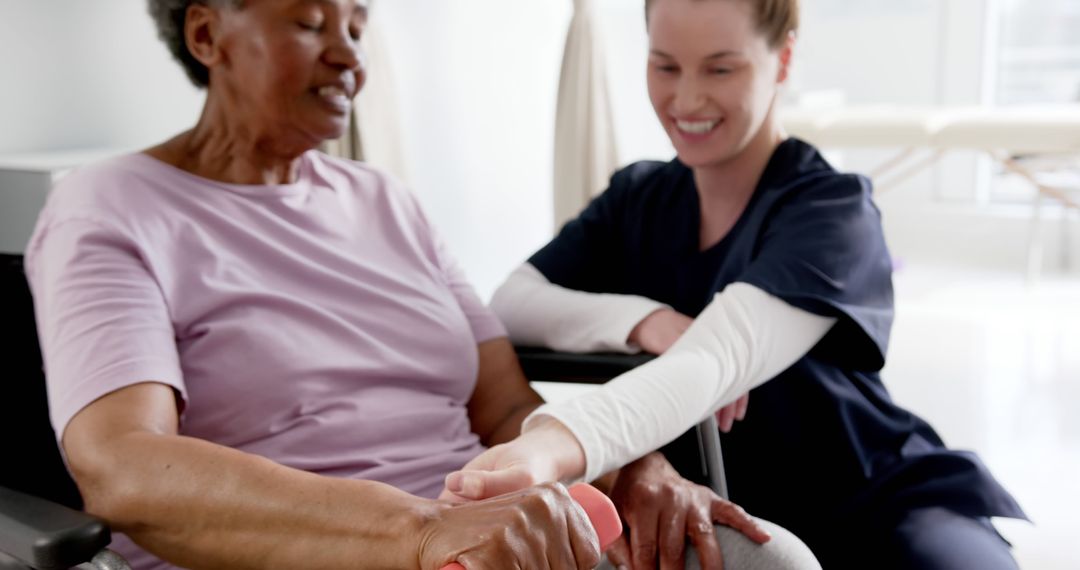 Physical Therapist Assisting Senior Woman Wid Grip Strength Exercise - Free Images, Stock Photos and Pictures on Pikwizard.com