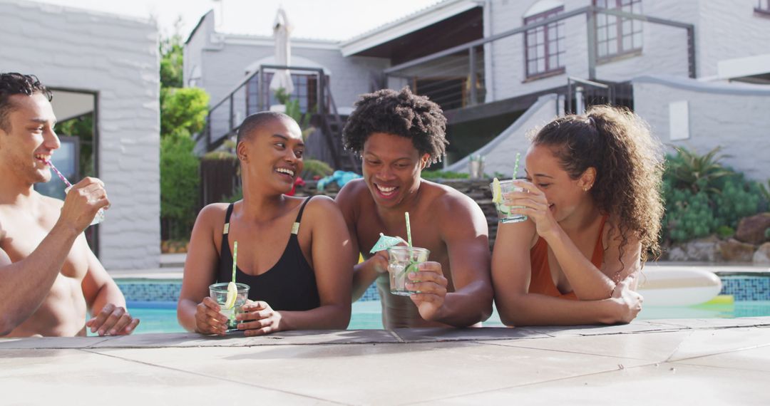 Group of Friends Enjoying Refreshing Poolside Drinks Together