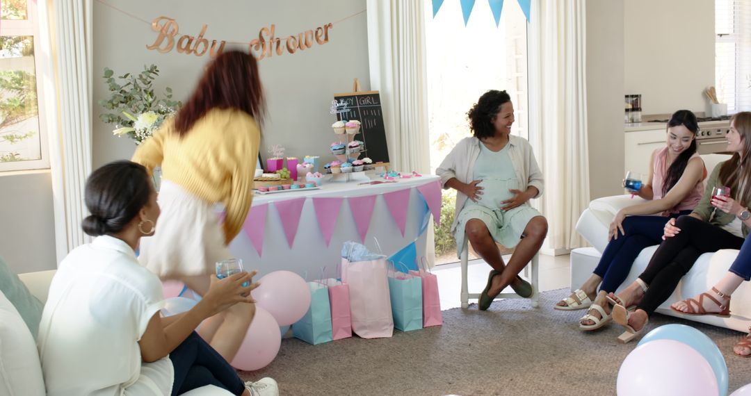 Multiracial Friends Celebrating Baby Shower in Bright Living Room