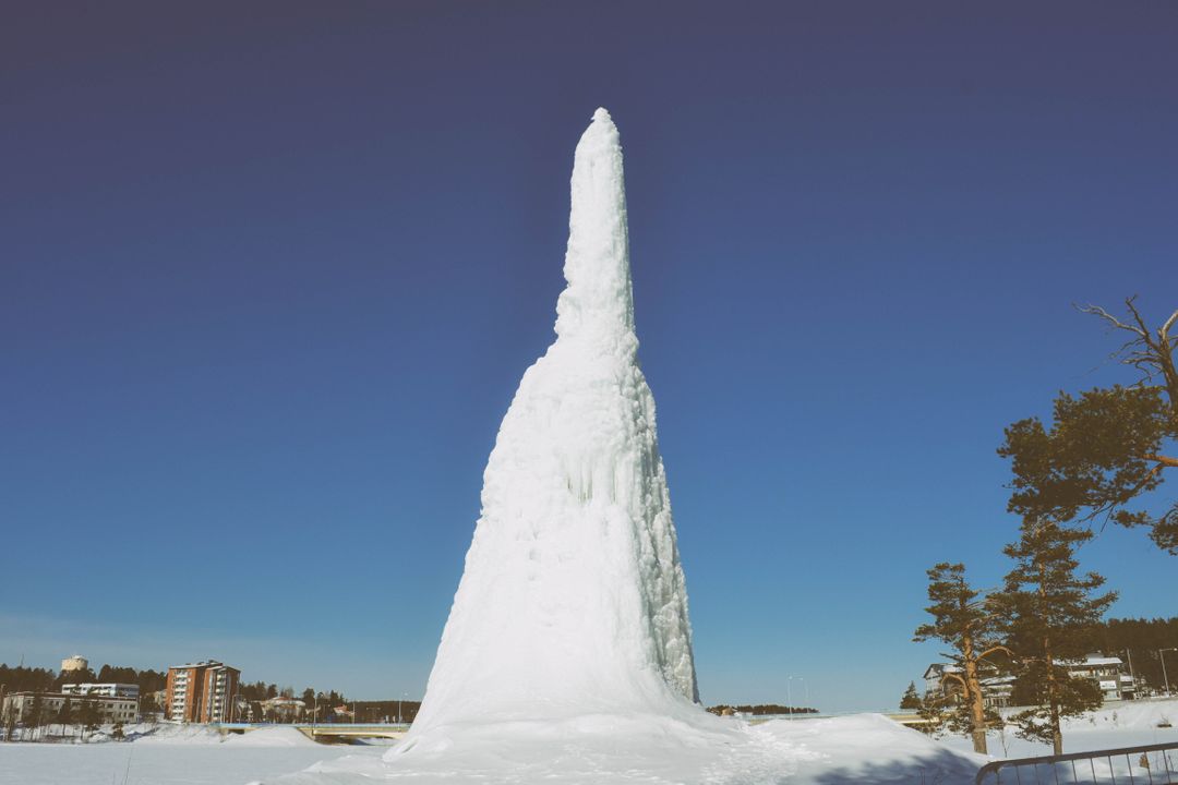 Giant Ice Formation Under Clear Blue Sky - Free Images, Stock Photos and Pictures on Pikwizard.com