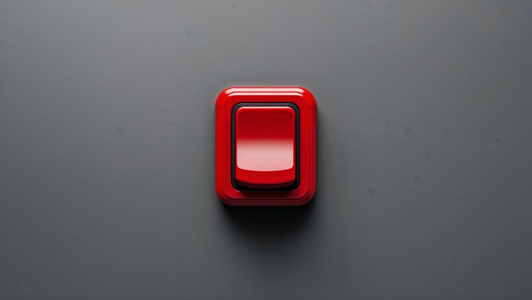 Glossy red button on matte grey surface, red alert button concept