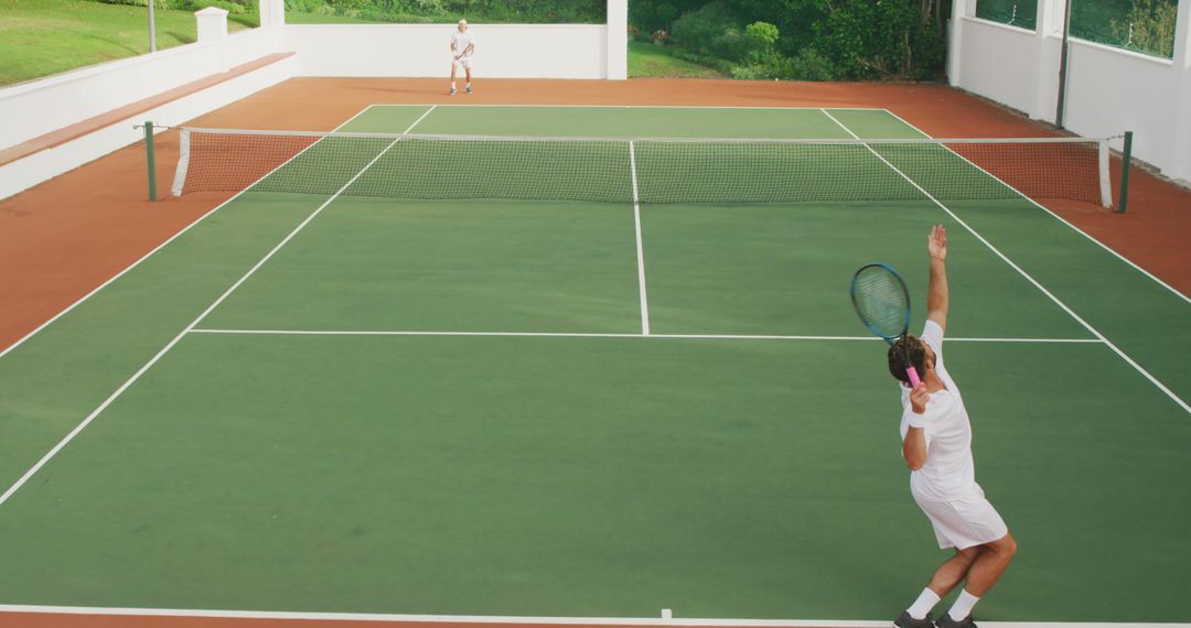 Players Engaging in Tennis Match on Outdoor Court - Free Images, Stock Photos and Pictures on Pikwizard.com