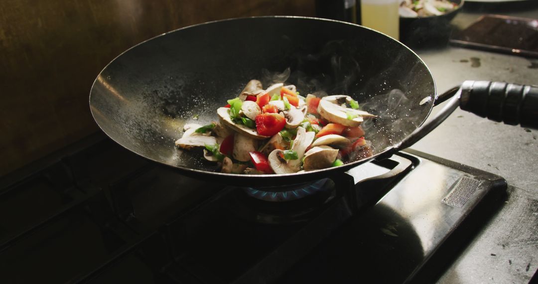 Stir Frying Fresh Vegetables in Wok on Stovetop - Free Images, Stock Photos and Pictures on Pikwizard.com