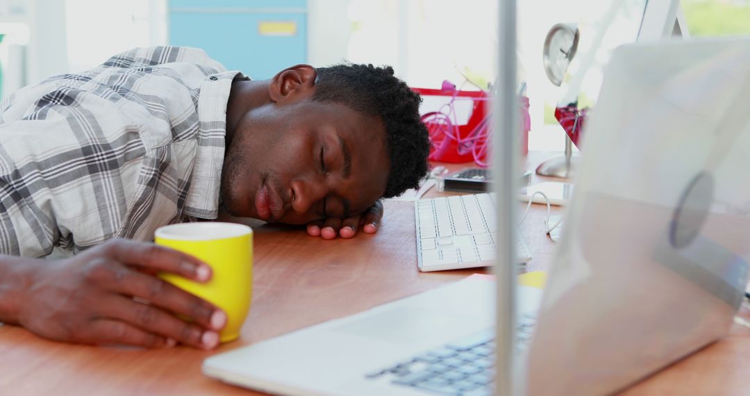 Tired Man Falling Asleep at Work Holding Coffee Cup Near Laptop - Free Images, Stock Photos and Pictures on Pikwizard.com