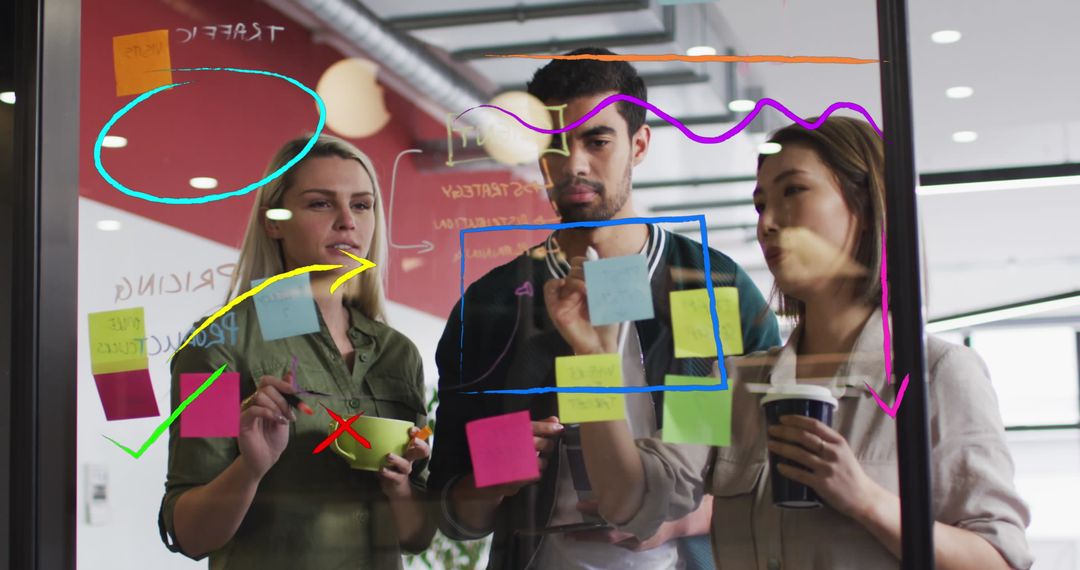 Collaborative Team Brainstorming on Glass Wall with Interface Mockups