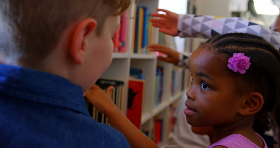 Diverse Children Exploring Books in School Library