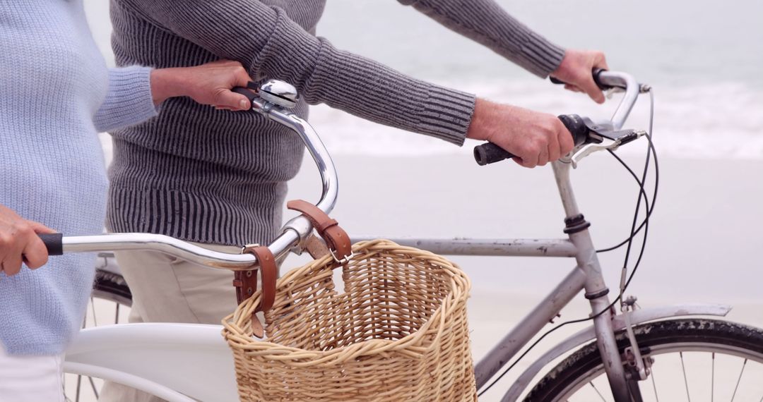 Close-Up of Senior Couple Riding Bicycles on Beach Summer Day - Free Images, Stock Photos and Pictures on Pikwizard.com