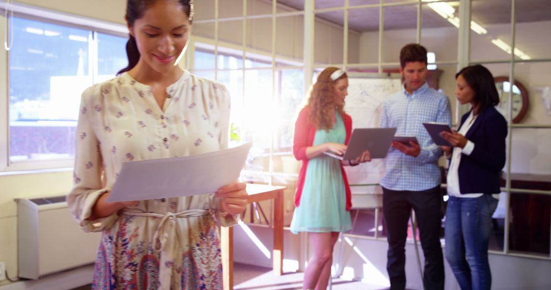 Young Professionals Collaborating in Bright Office Setting