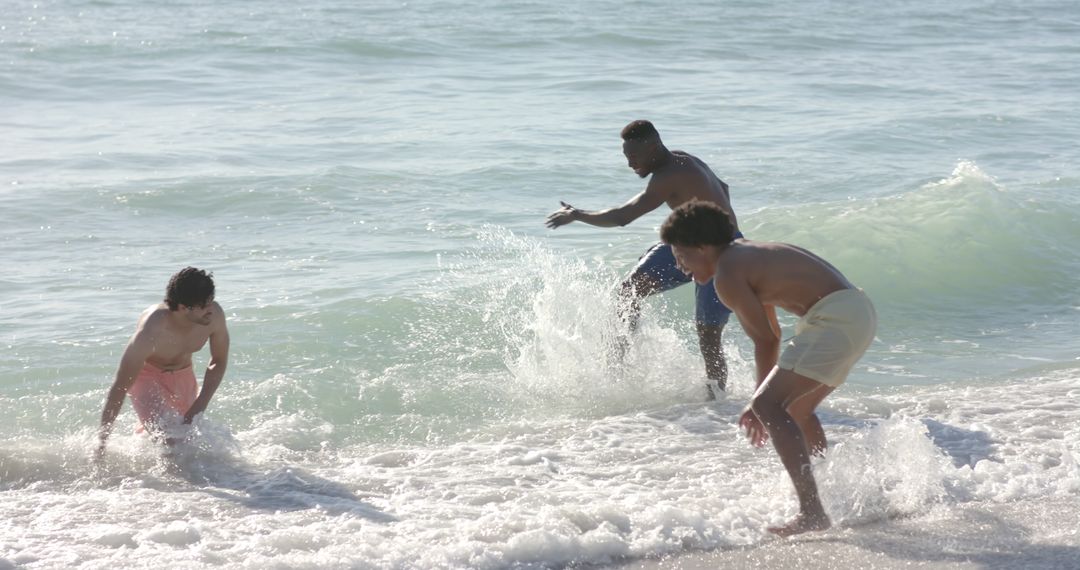 Friends Enjoying a Playful Day at the Beach in Ocean Waves