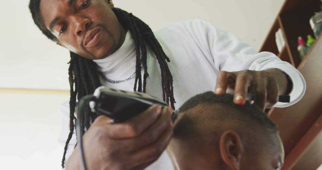 Professional Barber Trimming Client's Hair in Modern Barbershop - Free Images, Stock Photos and Pictures on Pikwizard.com