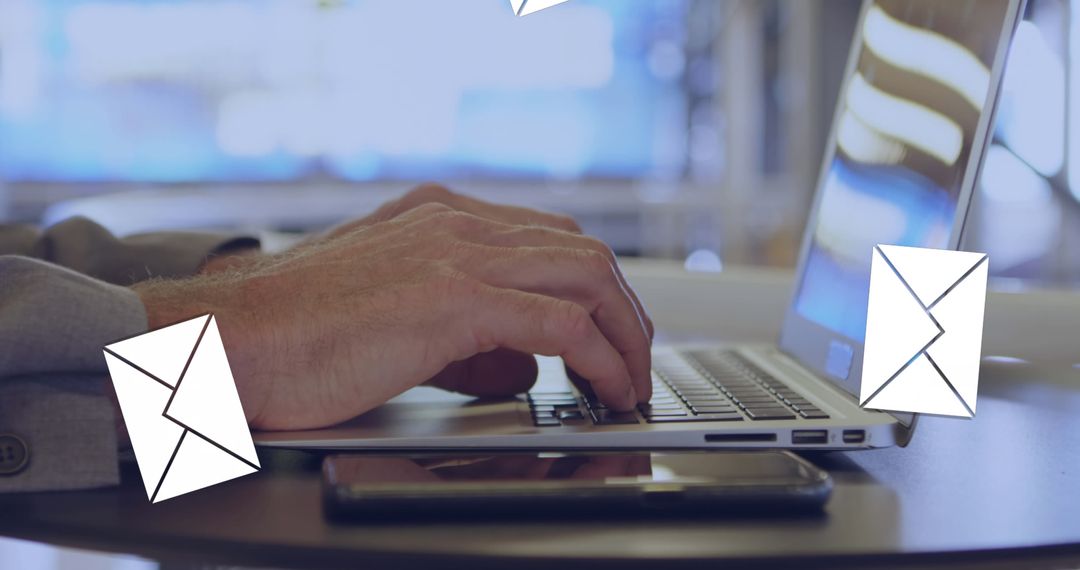 Businessman Typing on Laptop Sending Emails in Modern Office