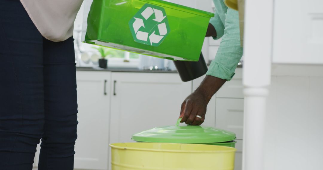 Couple Practicing Recycling at Home in Kitchen - Free Images, Stock Photos and Pictures on Pikwizard.com