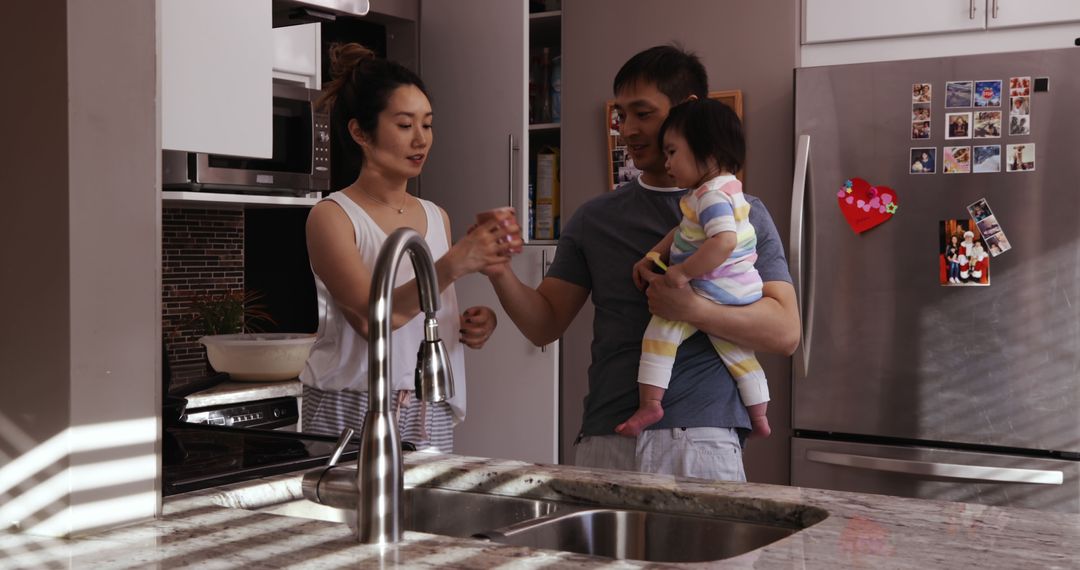 Young Family Preparing Food in Modern Kitchen - Free Images, Stock Photos and Pictures on Pikwizard.com