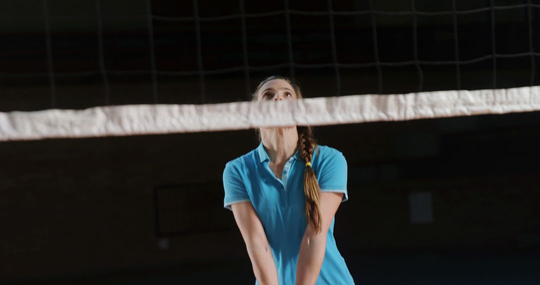 Woman Concentrating on Volleyball Practice Indoors - Free Images, Stock Photos and Pictures on Pikwizard.com