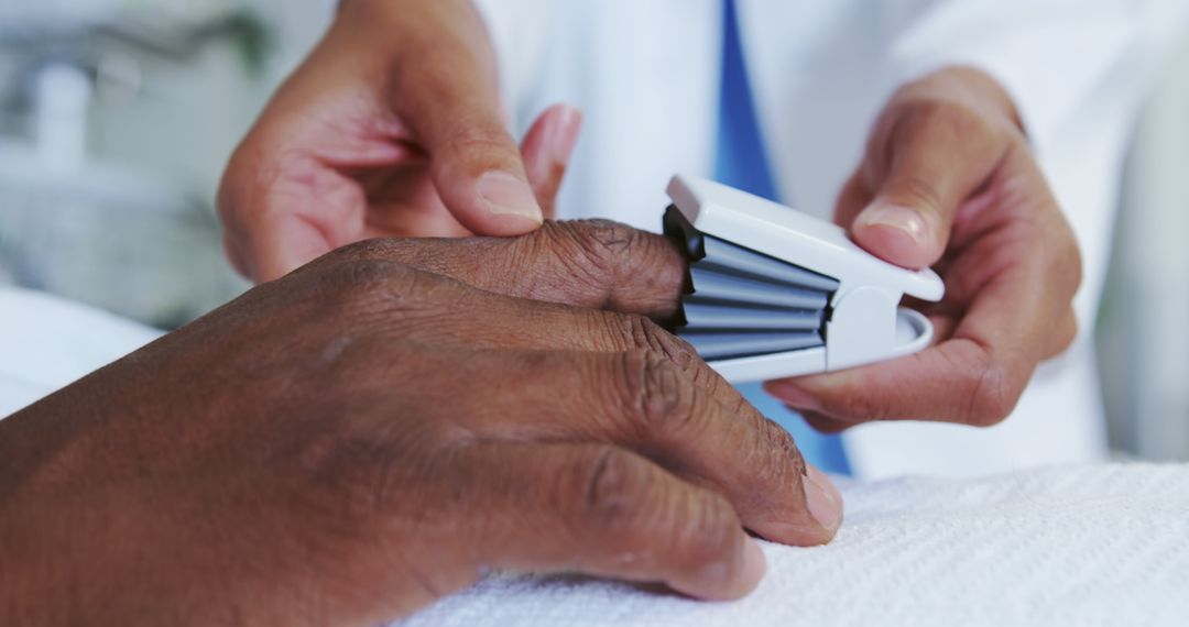 Doctor Checking Black Patient's Pulse with Pulse Oximeter - Free Images, Stock Photos and Pictures on Pikwizard.com