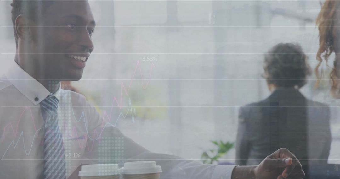 Businessman Collaborating with Financial Data Overlay in Modern Office