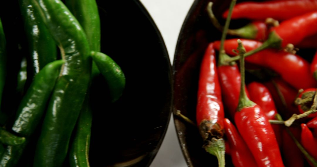 Close-up of Fresh Green and Red Chili Peppers in Bowls - Free Images, Stock Photos and Pictures on Pikwizard.com