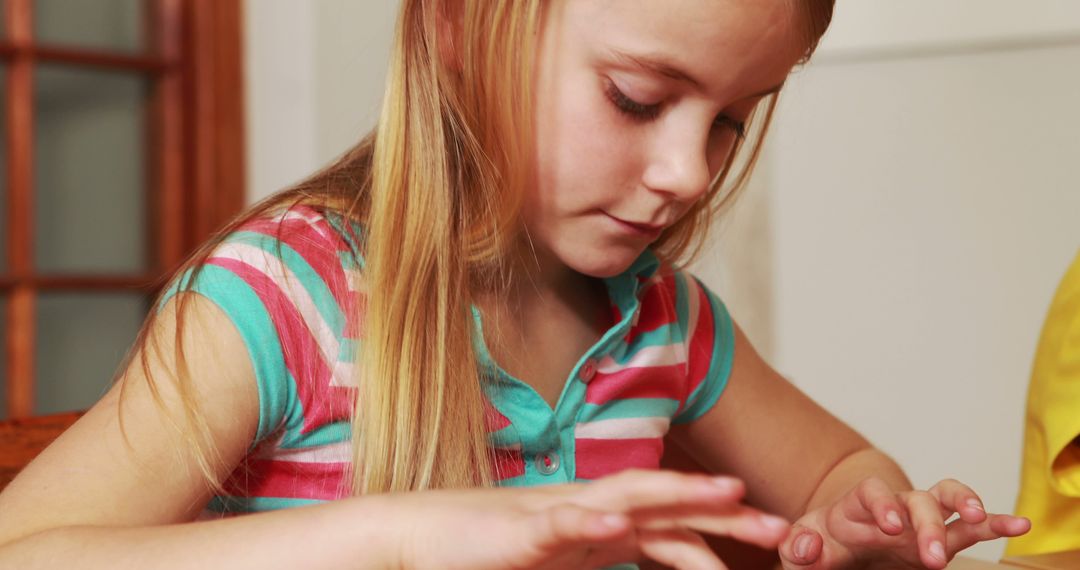 Young Girl Counting Fingers Focuses on Learning Math - Free Images, Stock Photos and Pictures on Pikwizard.com