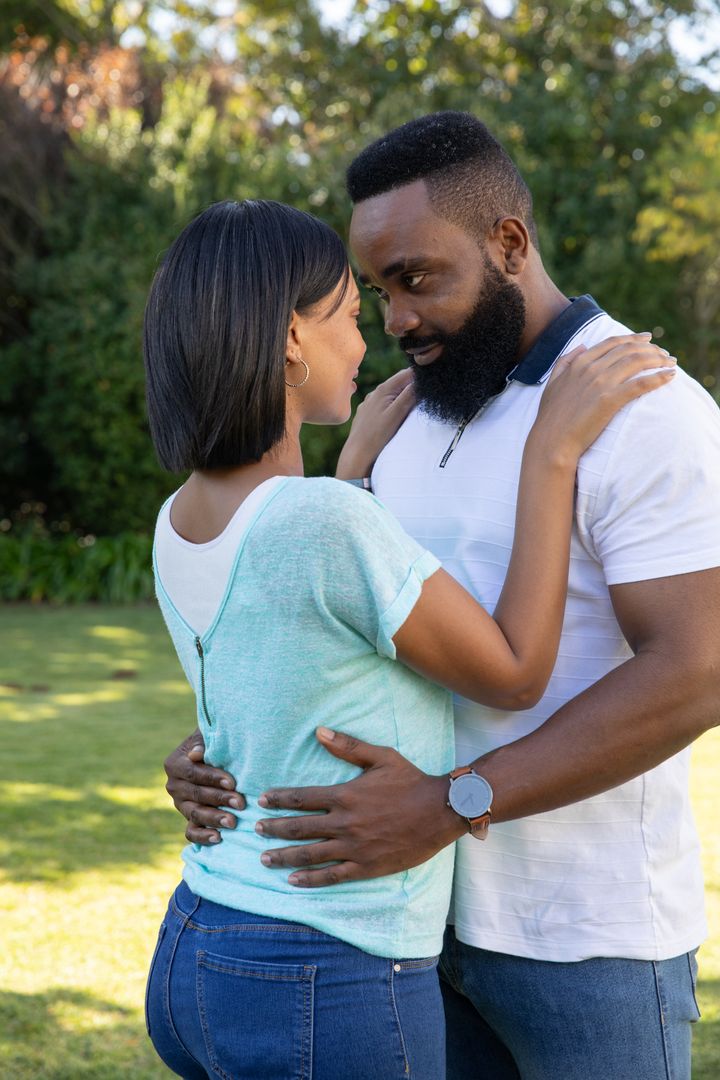 Intimate Couple Embracing in Park with Affectionate Connection