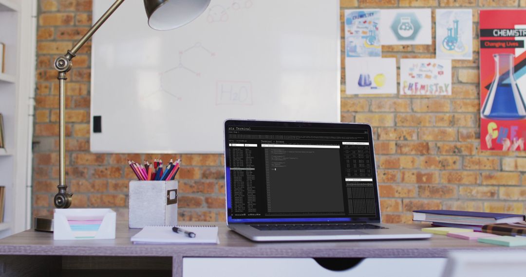 Laptop on Desk with Data Processing Interface in Modern Office